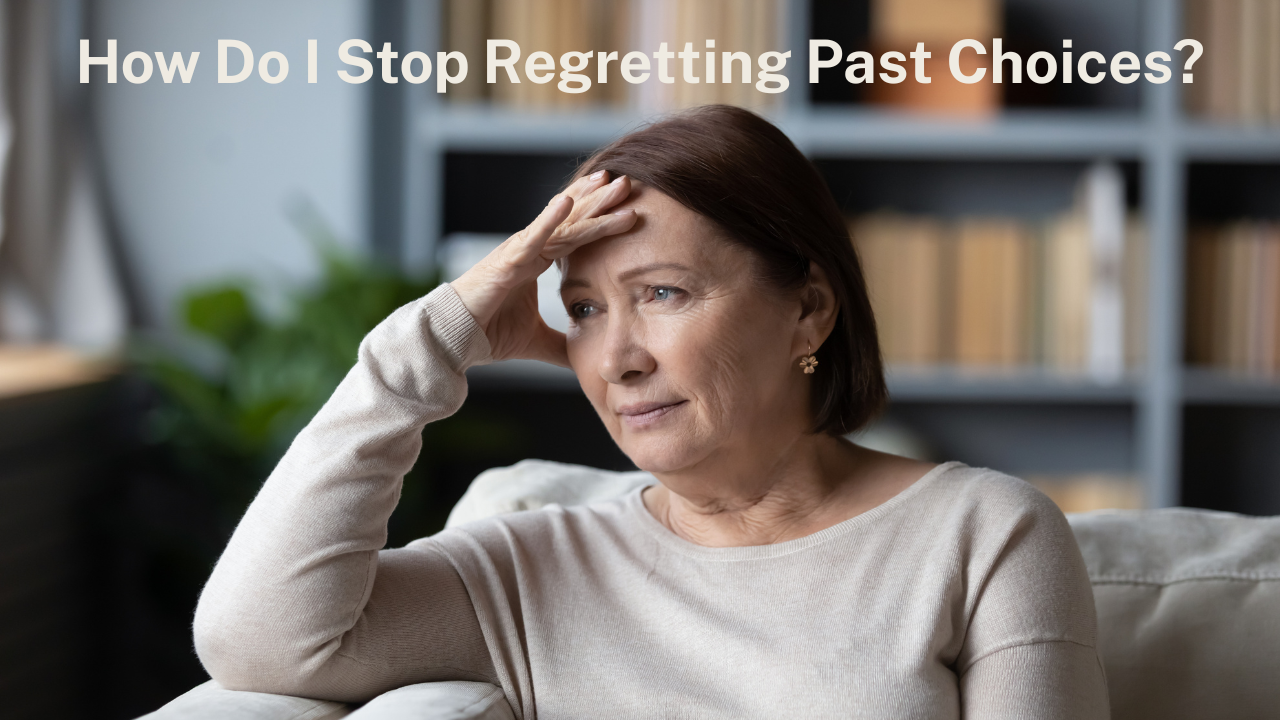A woman sitting on a couch with her hand up to her head in regret.
