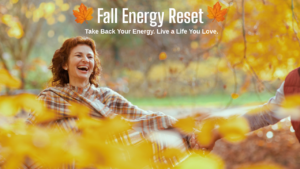 A woman happily jumping in the fall leaves.
